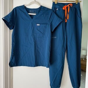 Women’s blue Figs Scrub set with orange accent string